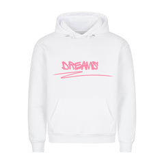 Der MarketPrint Premium Hoodie "Dreams" ist weiß, hat eine lockere Passform, eine Beuteltasche auf der Vorderseite und den Schriftzug "DREAMS" in rosa Graffiti auf der Brust.