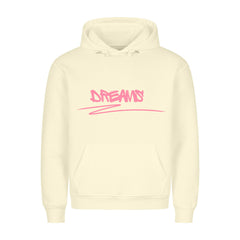 Der MarketPrint Premium Hoodie "Dreams" ist ein cremefarbener Kapuzenpulli mit gemütlicher Passform, Fronttasche und DREAMS in pinkem Graffiti-Stil auf der Brust.