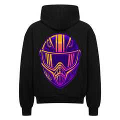 Der Oversized Zipper Hoodie "Streetfighter Helm" von MarketPrint ist schwarz, hat einen hochwertigen Reißverschluss und zeigt auf der Rückseite eine große, bunte, stilisierte Motorradhelm-Grafik in Lila, Orange und Gelb.