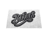 Das Bild zeigt "Bikers" in fetter Schreibschrift mit schattierten Umrissen, ideal für die MarketPrint Fußmatte "Bikers" um Schmutz ab zu halten auf einem hellen Hintergrund.
