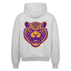 Der Oversized Zipper Hoodie "Bär" von MarketPrint ist ein hellgrauer Kapuzenpulli aus 100% Baumwolle mit übergroßer Passform und einem großen lila und gelben stilisierten Tigerkopf auf dem Rücken, der mit offenem Maul nach vorne zeigt.
