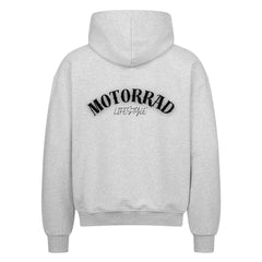 Der MarketPrint Oversized Zipper Hoodie "Motorrad Lifestyle" in hellgrau mit schwarzem MOTORRAD LIFESTYLE Schriftzug auf dem Rücken besteht aus 100% Baumwolle für Komfort und Style.