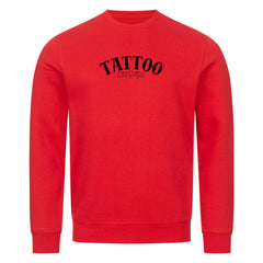 Das MarketPrint Premium Sweatshirt "TATTOO" ist ein unifarbener roter Unisex-Crewneck mit langen Ärmeln und schwarzem "TATTOO LIFESTYLE"-Schriftzug - ideal für Fans von nachhaltiger Mode.