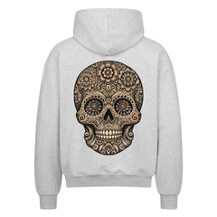 Der Oversized Zipper Hoodie "Totenkopf" von MarketPrint ist ein hellgrauer Premium-Kapuzenpullover mit übergroßer Passform, der einen auffälligen schwarzen und hellbraunen Totenkopf mit floralen und geometrischen Mustern auf der Rückseite zeigt. Hergestellt aus 100% Baumwolle für Komfort.