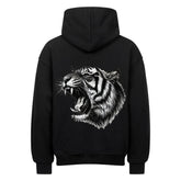 Der MarketPrint Oversized Hoodie "Tiger" ist ein schwarzer, schwerer Baumwoll-Kapuzenpulli mit einer großen, detaillierten weißen und grauen Illustration eines brüllenden Tigerkopfes auf dem Rücken. Flach dargestellt, zeigt er das Design von hinten.