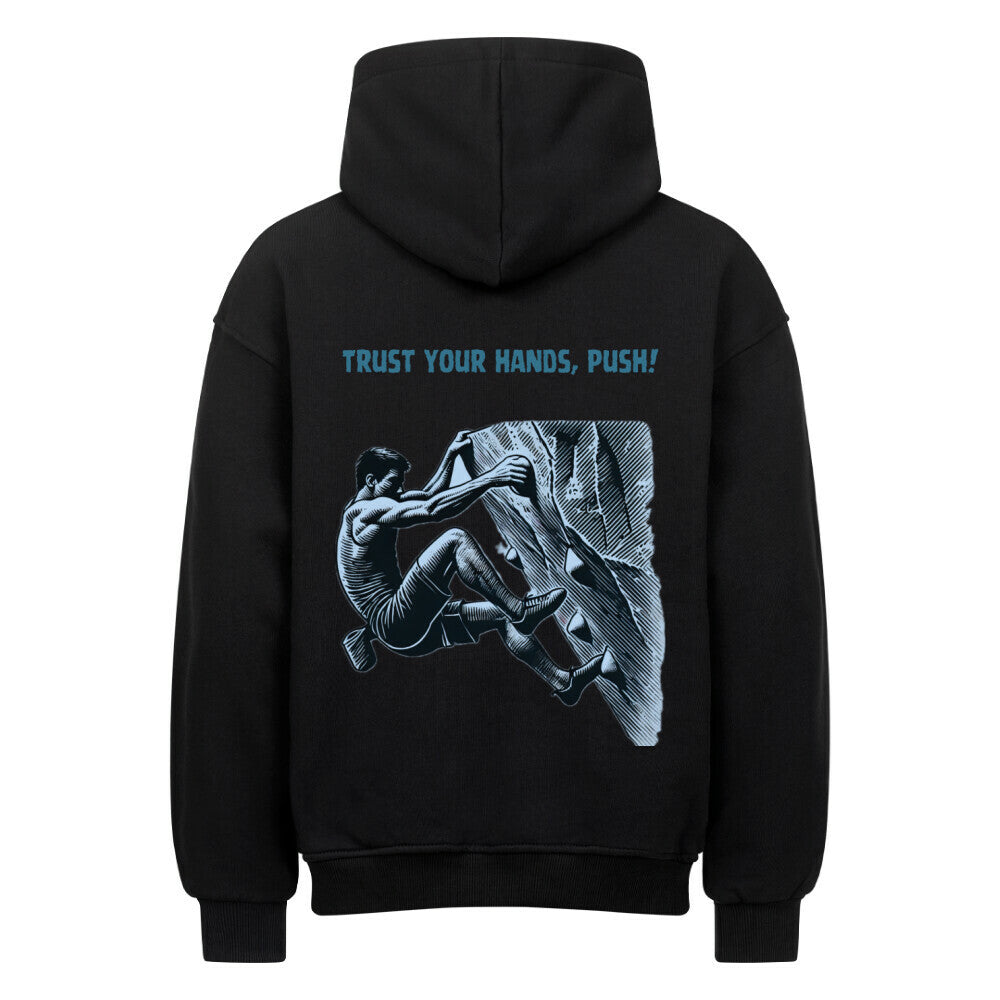 Der MarketPrint Oversized Hoodie "Bouldern" ist ein schwarzes Sweatshirt aus schwerer Baumwolle mit der Illustration einer bouldernden Person und dem fetten blauen Text TRUST YOUR HANDS, PUSH!.