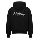 Der Oversized Zipper Hoodie "Infinity" von MarketPrint trägt den Schriftzug "Infinity" in fetten, hellgrauen Lettern auf dem Rücken. Dieser schwarze Premium-Kapuzenpulli ist aus 100% Baumwolle gefertigt und wird flach liegend mit der Rückseite nach vorne gezeigt.