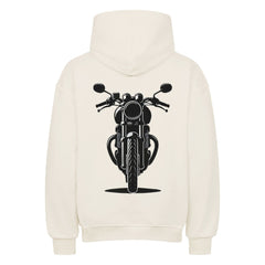 Der Oversized Hoodie "Motorrad" von MarketPrint ist ein cremefarbener Premium-Kapuzenpulli mit einer auffälligen schwarzen Motorradgrafik auf der Vorderseite, die auf dem Rücken zentriert ist. Er ist aus schwerer Baumwolle gefertigt und bietet einen hohen Tragekomfort.