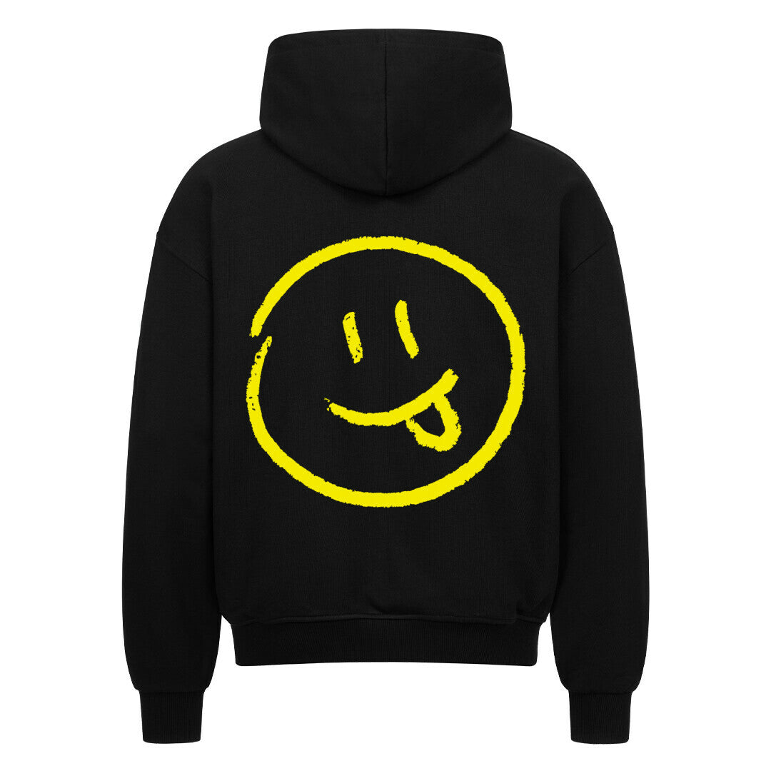 Der MarketPrint Oversized Zipper Hoodie "Smiley" ist ein schwarzer Kapuzenpulli aus 100% Baumwolle mit einer übergroßen Passform und einer großen gelben Smiley-Grafik auf dem Rücken.