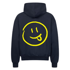 Der MarketPrint Oversized Zipper Hoodie "Smiley" ist ein schwarzer Kapuzenpulli aus 100% Baumwolle mit einem großen, skizzenhaften gelben Smiley-Gesicht mit herausgestreckter Zunge, mittig auf dem Rücken.