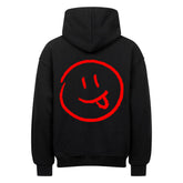 Der Oversized Hoodie "Smiley" von MarketPrint ist ein schwarzer, schwerer Baumwoll-Kapuzenpulli mit einem auffälligen roten Smiley-Gesicht und einer herausgestreckten Zunge auf dem Rücken, die mit einfachen Strichaugen für einen verspielten Touch sorgt.