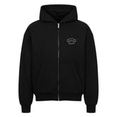 Der Oversized Zipper Hoodie "Schlagring" von MarketPrint ist ein schlichter, schwarzer Premium-Kapuzenpulli mit einer Fronttasche, Schlagring-Grafik auf der linken Brust, Kapuze und gerippten Bündchen und Saum. Hergestellt aus 100% Baumwolle für maximalen Komfort.