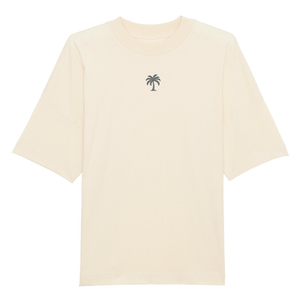 Das Premium Oversize Blast "Strand" T-Shirt von Infinity Merch ist ein lässiges Off-White Bio-Baumwollshirt mit kurzen Ärmeln und schlichter schwarzer Palmen-Grafik auf der Brust.