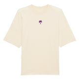 Das Premium Oversize Blast "strand" T-Shirt von Infinity Merch ist aus Bio-Baumwolle, kurzärmelig, off-white und zeigt mittig ein kleines lila Palmenmotiv auf der Brust.