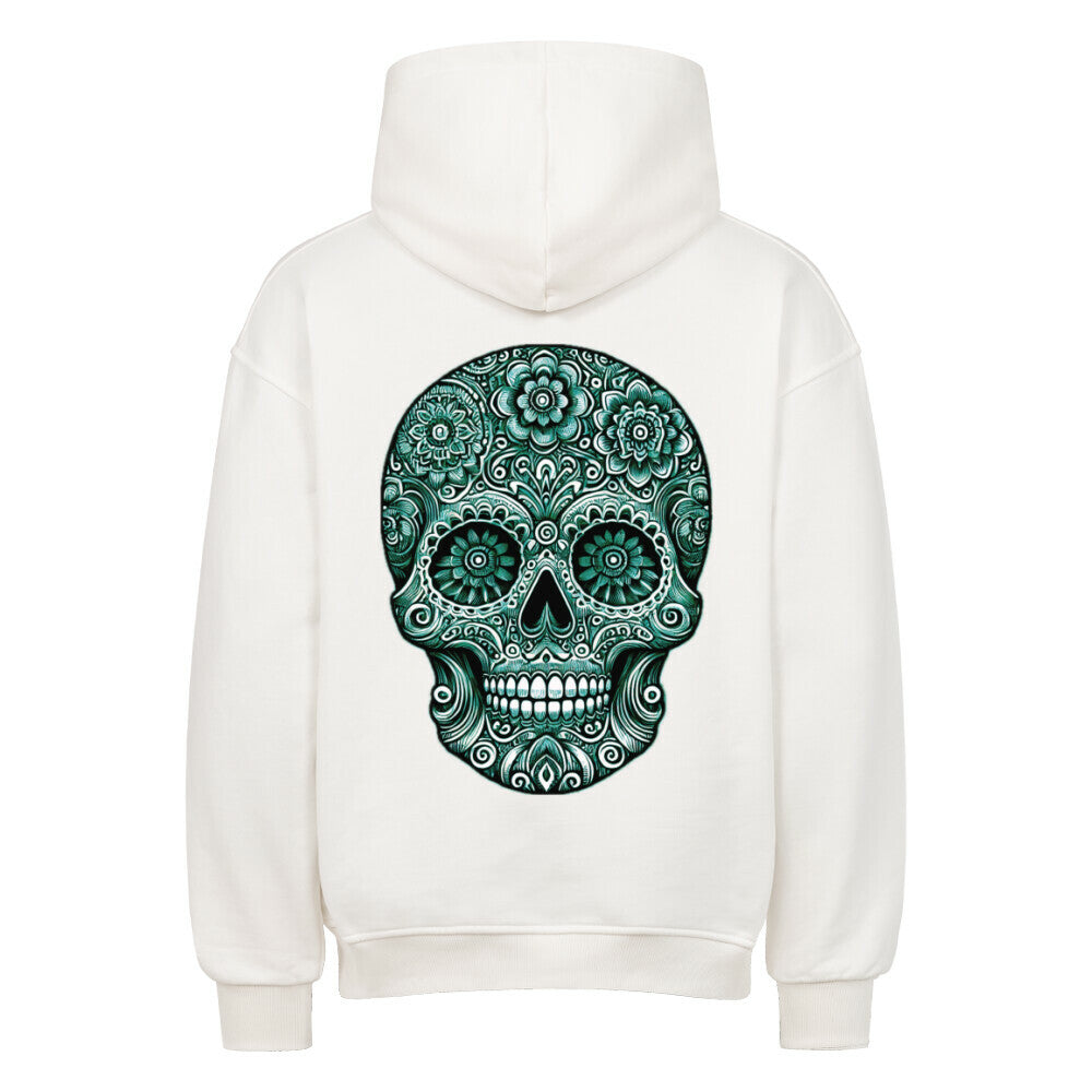 Der Oversized Hoodie "Totenkopf" von MarketPrint ist aus schwerer weißer Baumwolle gefertigt und zeigt einen detaillierten grünen Zuckerschädel mit Blumen- und Wirbelmustern auf der Rückseite. Premium-Qualität, rückseitig ausgestellt.