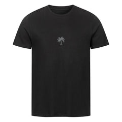 Das Premium Shirt "Palme-Sonnenuntergang" von MarketPrint ist ein schlichtes schwarzes Unisex Singlejersey T-Shirt mit einer kleinen weißen Palmengrafik auf der Brust, hergestellt aus weichem Bio-Baumwolle T-Shirt Stoff.