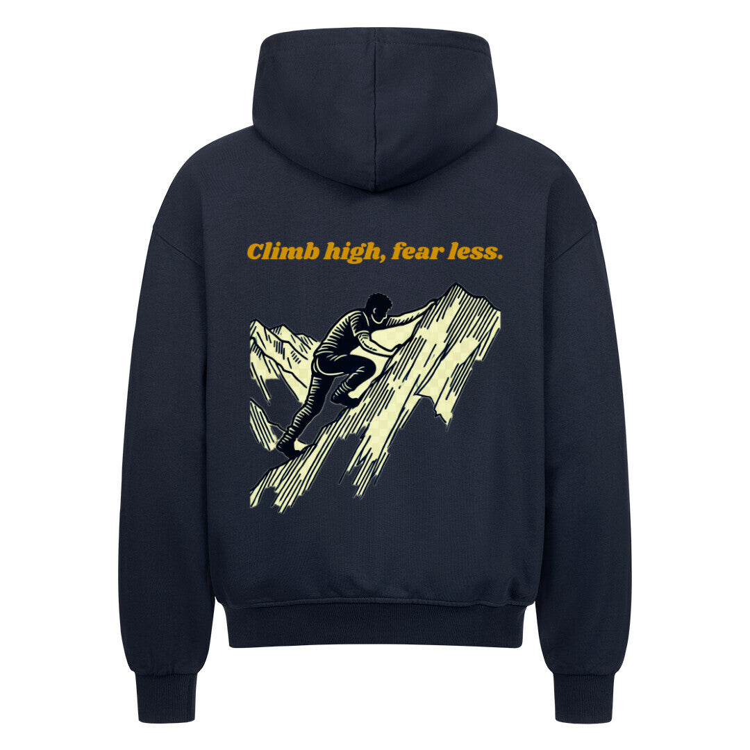 Der schwarze MarketPrint Oversized Zipper Hoodie "Climb high, fear less" zeigt eine gelbe Bergsteiger-Illustration und einen fetten Slogan auf 100% Baumwolle für Komfort.