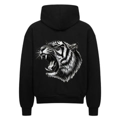 Der Oversized Zipper Hoodie "Tiger" von MarketPrint ist ein schwarzer Premium-Kapuzenpulli mit einem auffälligen Tigergesicht, gefertigt aus 100% Baumwolle und in einer übergroßen Passform für Komfort und Stil.