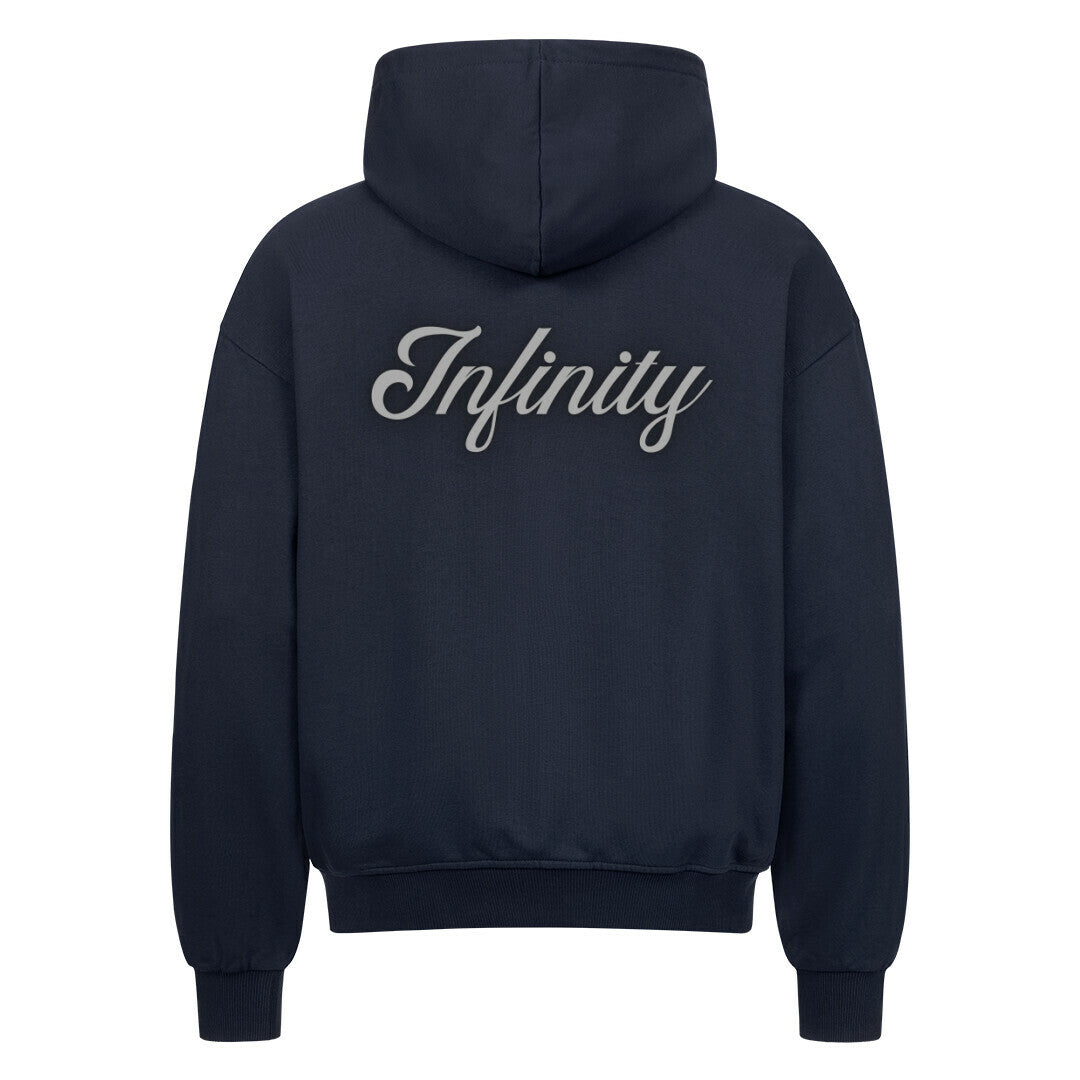 Der MarketPrint Oversized Zipper Hoodie "Infinity" in navyblau hat einen großen, kursiven weißen "Infinity"-Schriftzug auf dem Rücken. Hergestellt aus 100% Baumwolle und abgebildet auf einem einfarbig weißen Hintergrund.