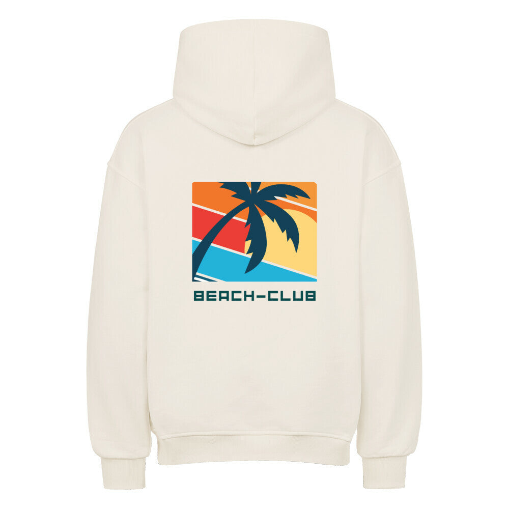 Der MarketPrint Oversized Hoodie "Beach-club" in Creme hat eine auffällige Rückengrafik mit einer schwarzen Palme und einem Sonnenuntergang. Er ist aus schwerer Baumwolle gefertigt und vereint auffälligen Stil und Komfort für deinen Freizeitlook.