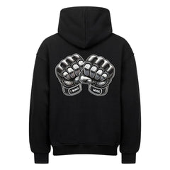 Der MarketPrint Oversized Hoodie "MMA" ist ein schwarzer Premium-Kapuzenpulli mit einer Rückengrafik von zwei sich berührenden Fäusten, die jeweils mit MMA auf den Handgelenken bedruckt sind.