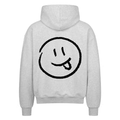 Der MarketPrint Oversized Zipper Hoodie "Smiley" in Hellgrau, von hinten gesehen, zeigt ein großes schwarz umrandetes Smiley-Gesicht mit herausgestreckter Zunge auf dem oberen Rücken. Hergestellt aus 100% Baumwolle für erstklassigen Komfort.
