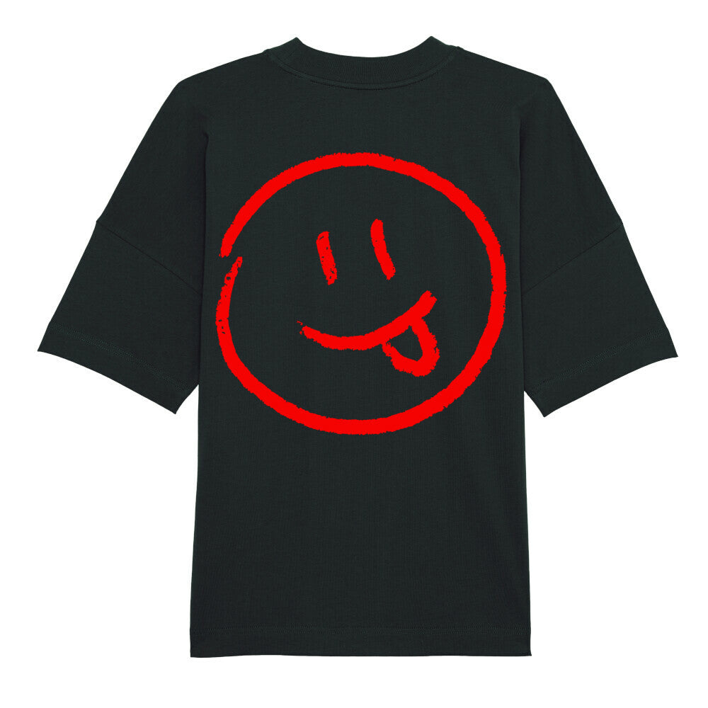 Das Premium Oversize Blast "Smiley" T-Shirt von MarketPrint ist lässig geschnitten, schwarz, aus Bio-Baumwolle und zeigt einen großen roten Smiley mit herausgestreckter Zunge mittig auf der Vorderseite.