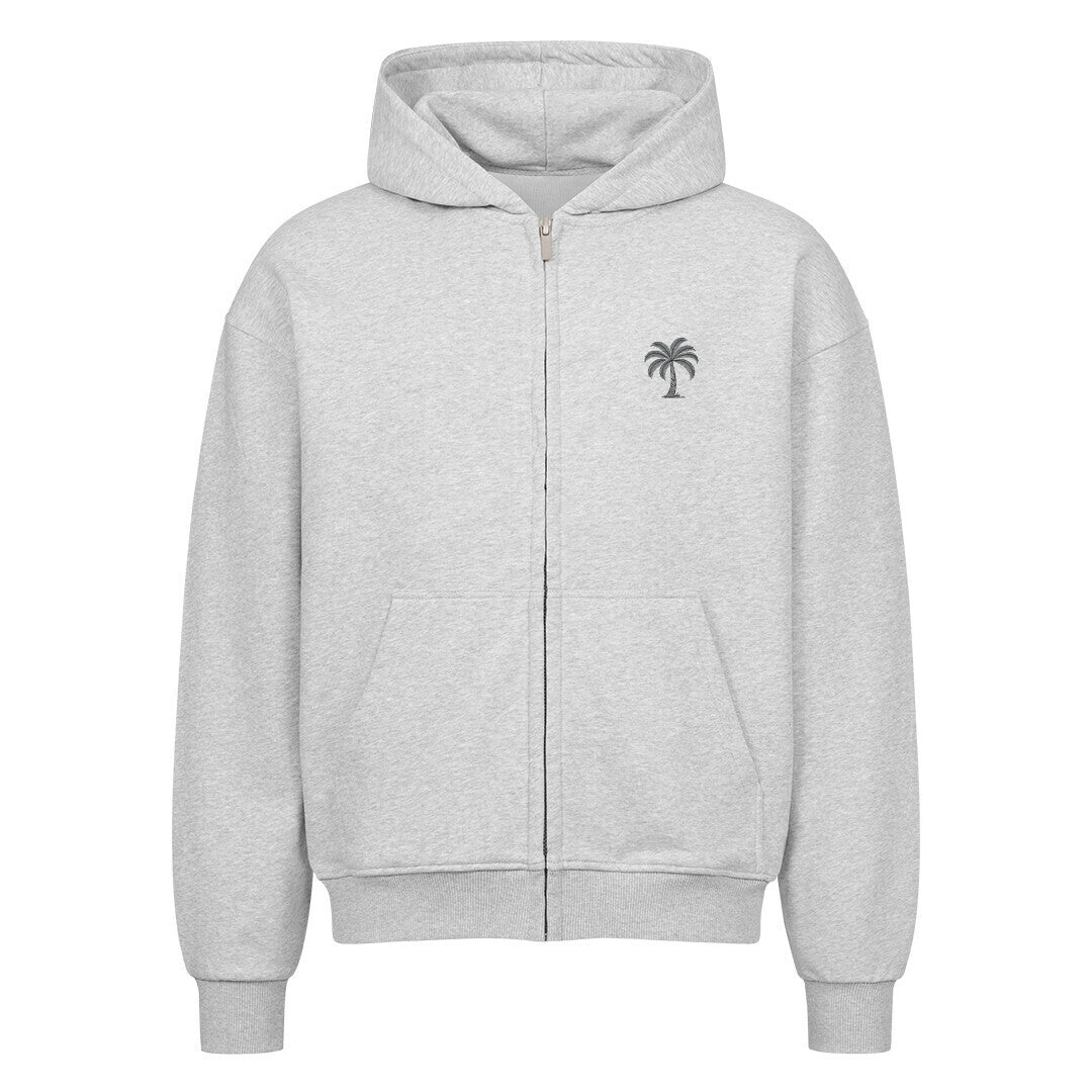 Der Oversized Zipper Hoodie "Strand" von Infinity Merch ist ein hellgrauer Kapuzenpullover aus 100% Baumwolle mit einer kleinen schwarzen Palme auf der Brust, einer Vordertasche, einer Kapuze mit Kordelzug und gerippten Bündchen an Ärmeln und Saum für Komfort und Style.