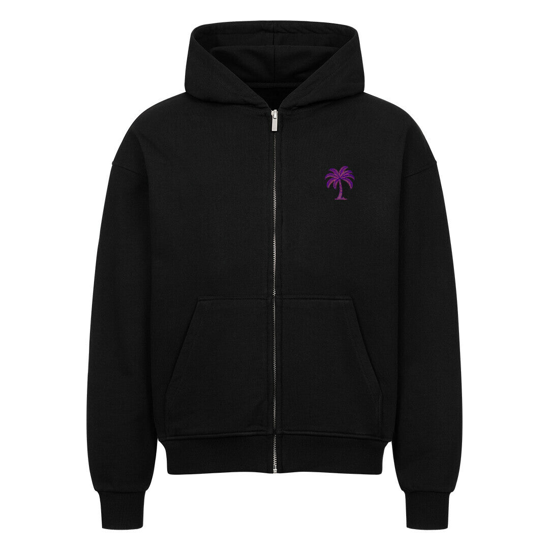 Der Infinity Merch Oversized Zipper Hoodie "Strand" ist schwarz und hat eine Kapuze, Vordertaschen und eine kleine lila Palmengrafik auf der linken Brust. Er ist aus 100% Baumwolle in einem übergroßen Schnitt gefertigt und erscheint vor einem schlichten weißen Hintergrund.