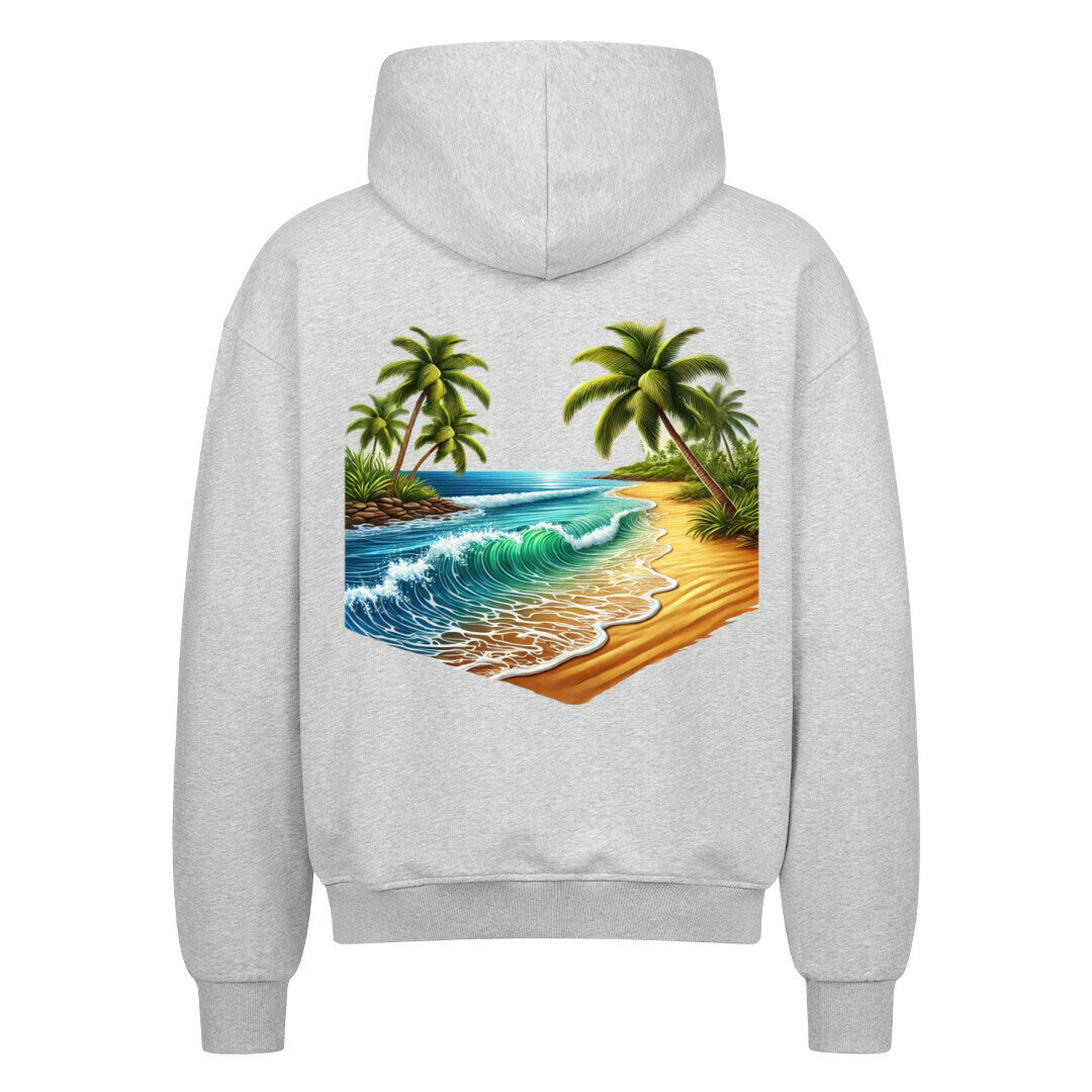 Der Infinity Merch Oversized Zipper Hoodie "Strand" in Grau zeigt eine farbenfrohe tropische Strandgrafik mit Palmen, Meereswellen und einem Sandstrand auf dem Rücken.