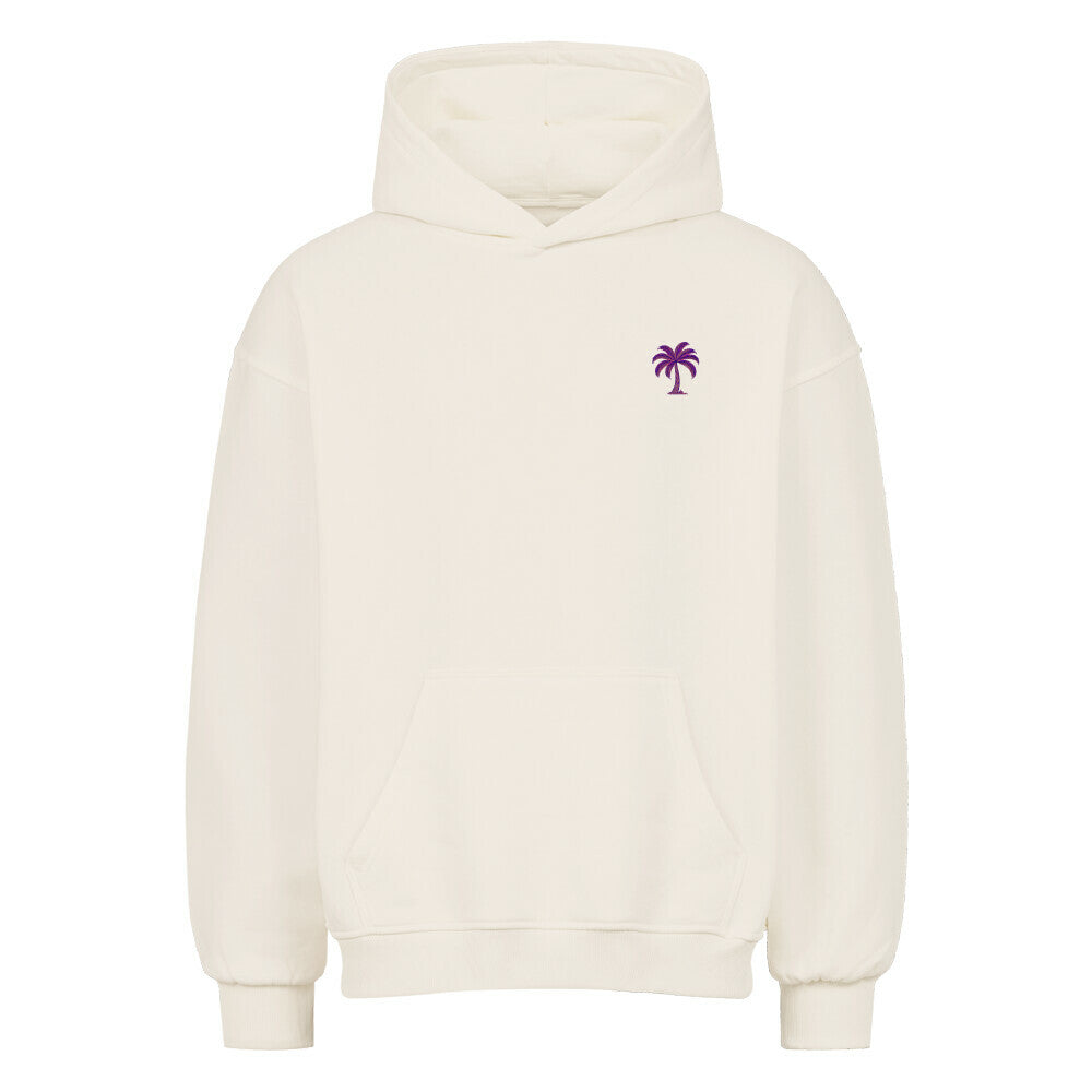 Der Infinity Merch Oversized Hoodie "Strand" ist ein hochwertiger, schlichter weißer Hoodie mit einer Fronttasche und einer kleinen lila Palmengrafik auf der linken Brust.